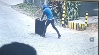 8 Chilling moment abducted girl 8 is wheeled through the street in a suitcase.png