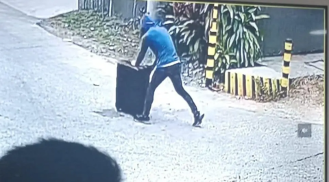 8 Chilling moment abducted girl 8 is wheeled through the street in a suitcase.png